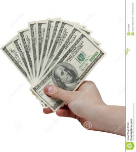 bill of sale for business hand holding stack cash